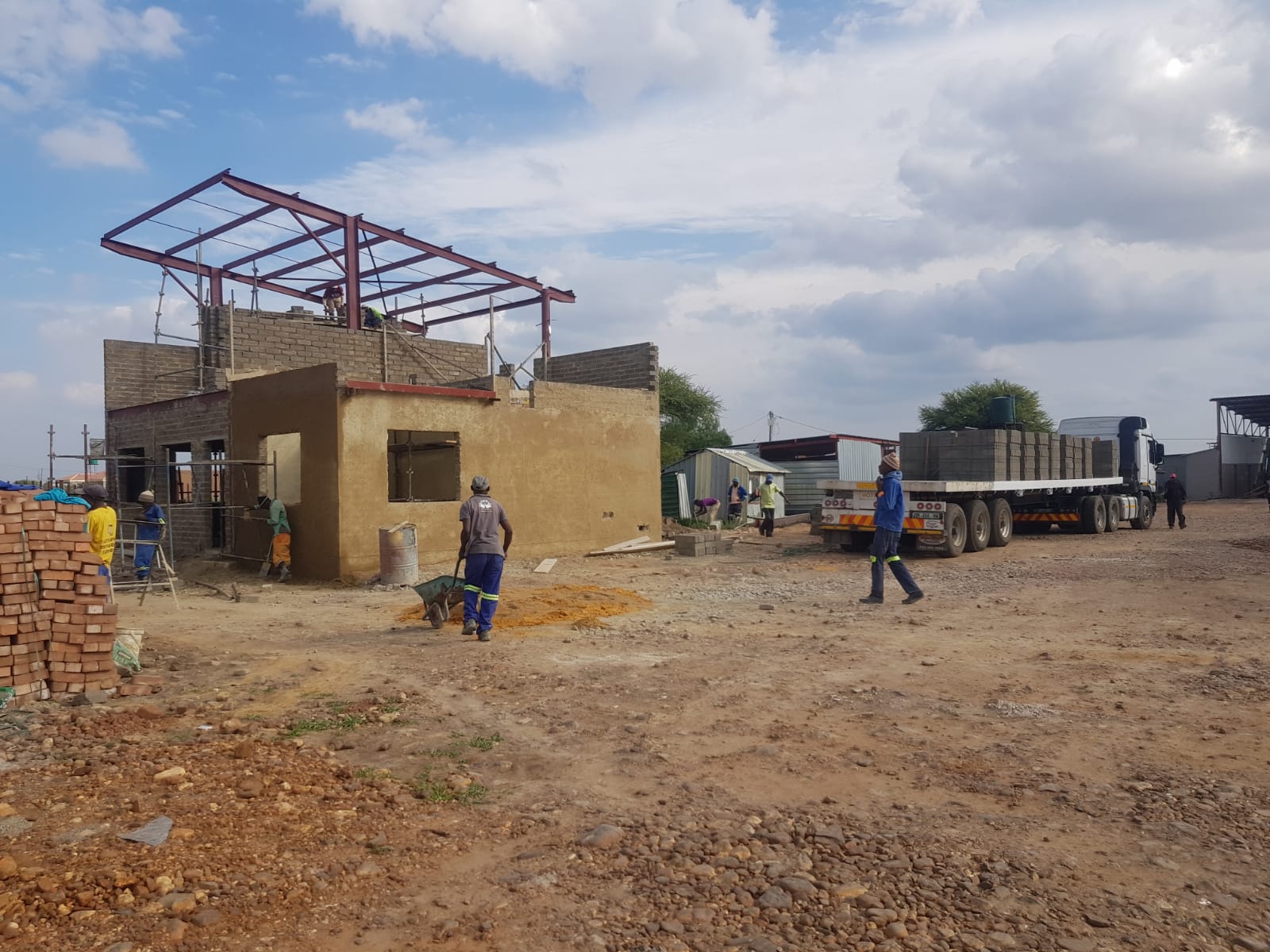 JJL Main Office — Build Process — Step 3 — Brickwork & roof trusses underway