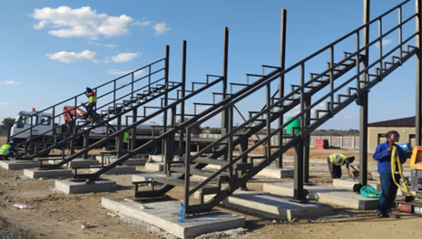Logageng Sports Facility — Raker beams & stair stringers installed