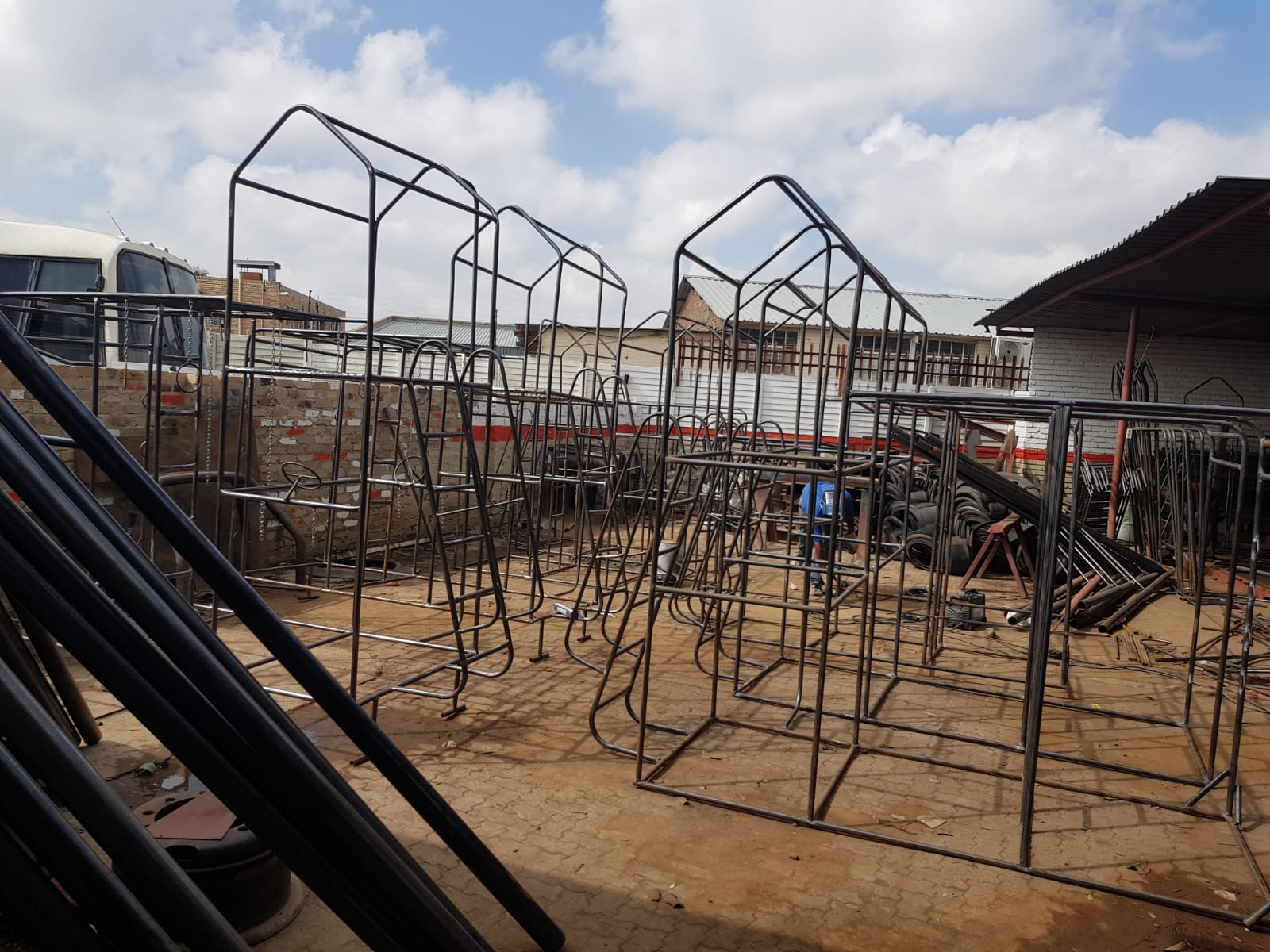 Jungle Gyms & Swings — Raw steel frames in the fabrication yard