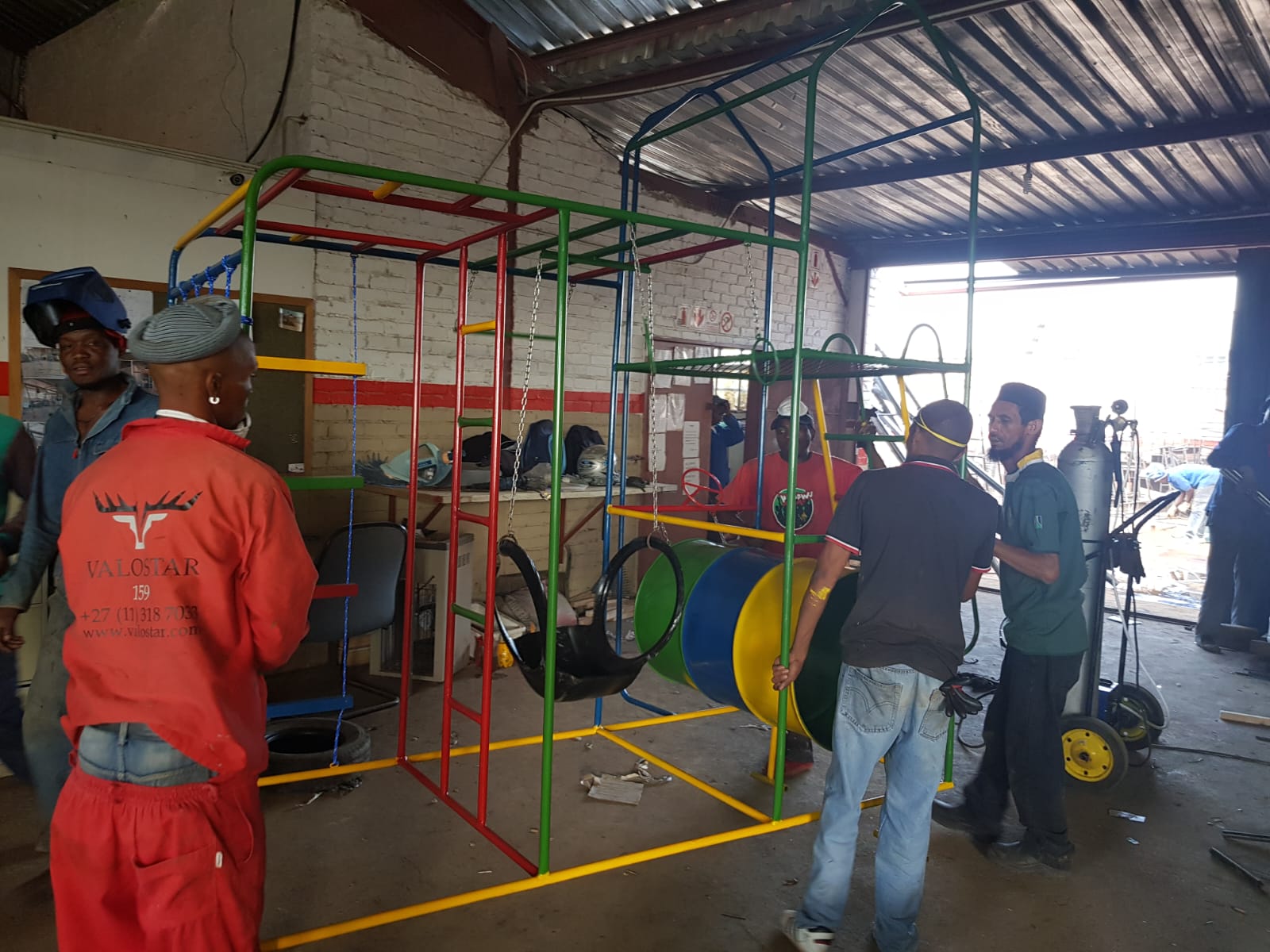 Jungle Gyms & Swings — Assembly in workshop — welding canopy frame