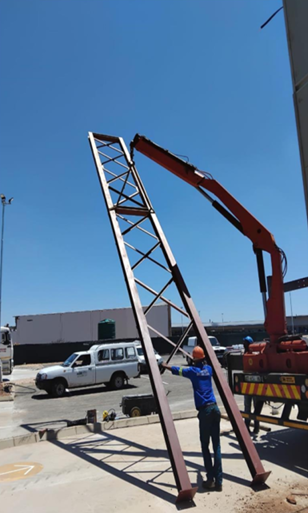 Village Mall Klerksdorp — Crane lifting signage tower frame into position