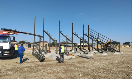 Logageng Sports Facility — Columns erected — first raker beams lifted into place