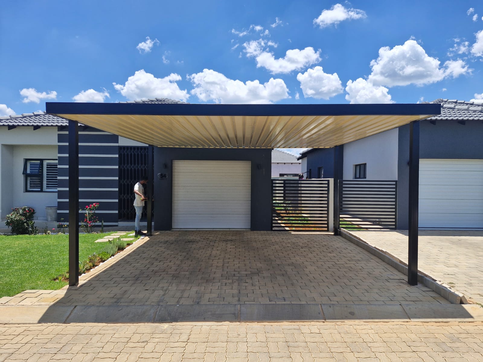 Melrose Carports — Front elevation with matching slat gate