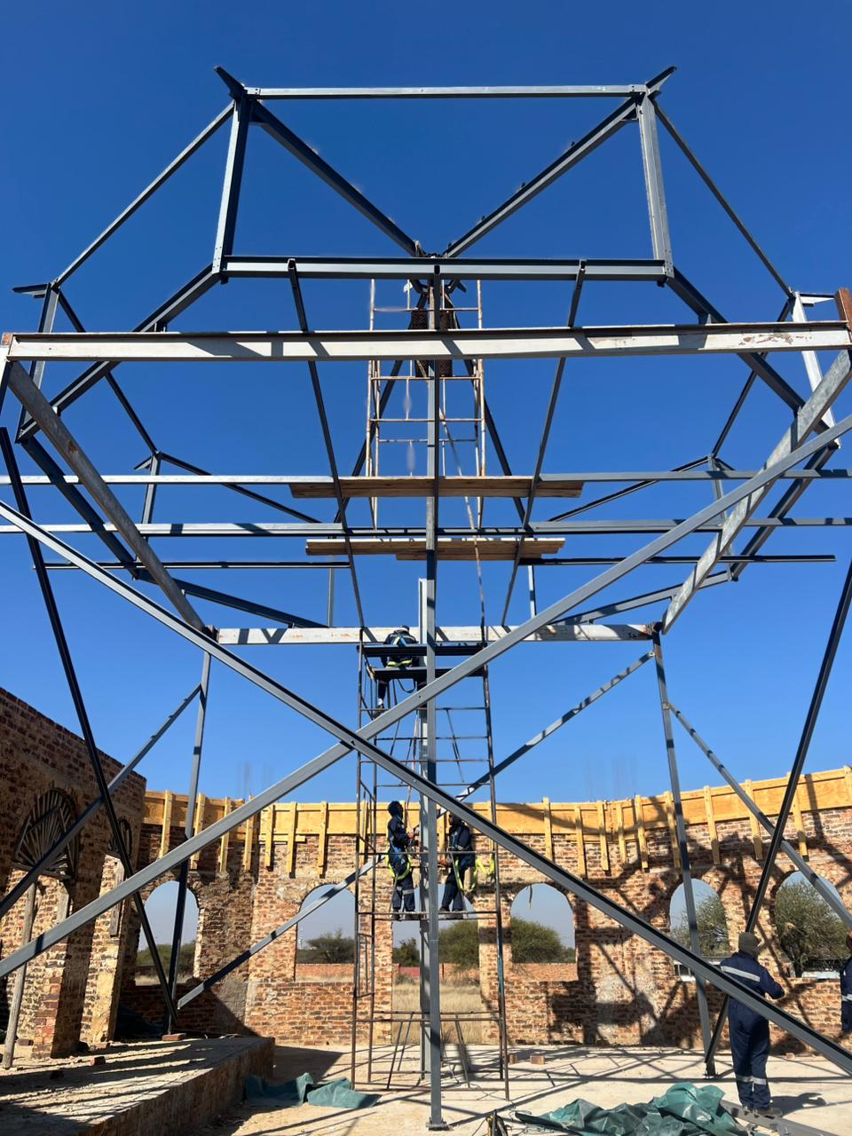 Saint Gabriel Church — Side view — main roof trusses bolted onto the brickwork