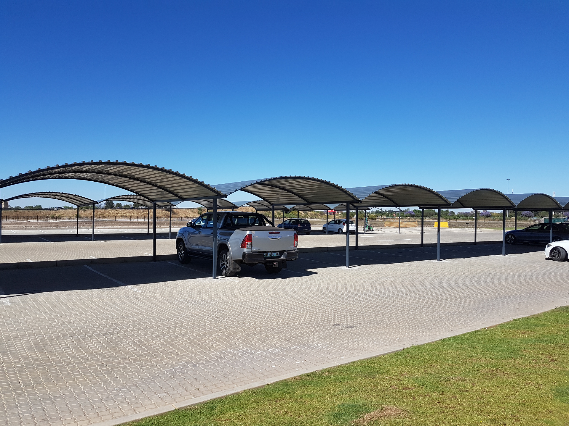 Curro Academy Carports — Completed parking rows — wide site view